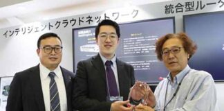 Osamu Nakamura, Chairman of the Judging Committee (right) presenting Huawei Japan with a Best in Show Award