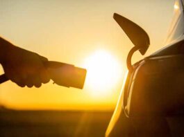 Car charging at sunrise